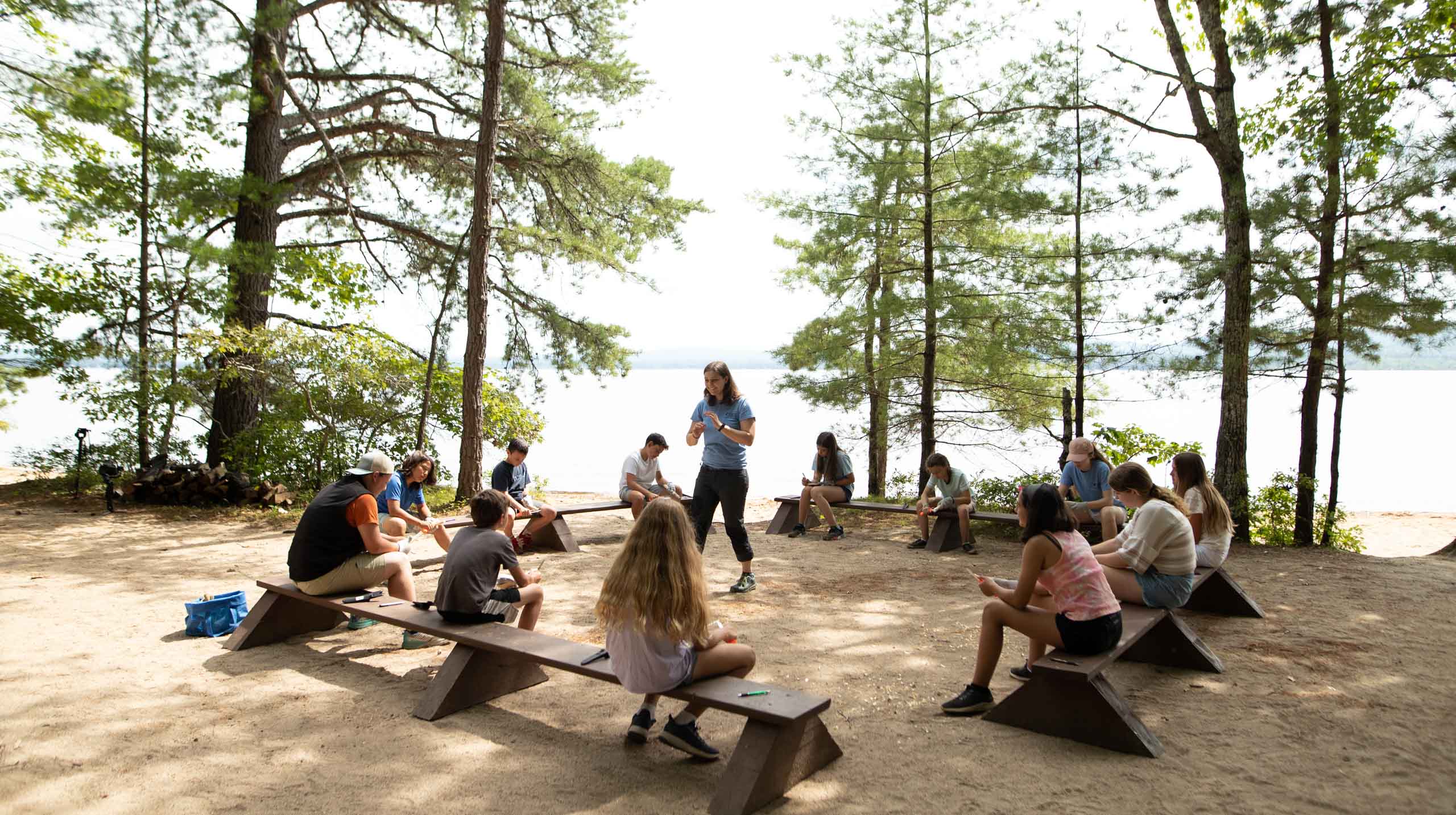 People on picnic benches.