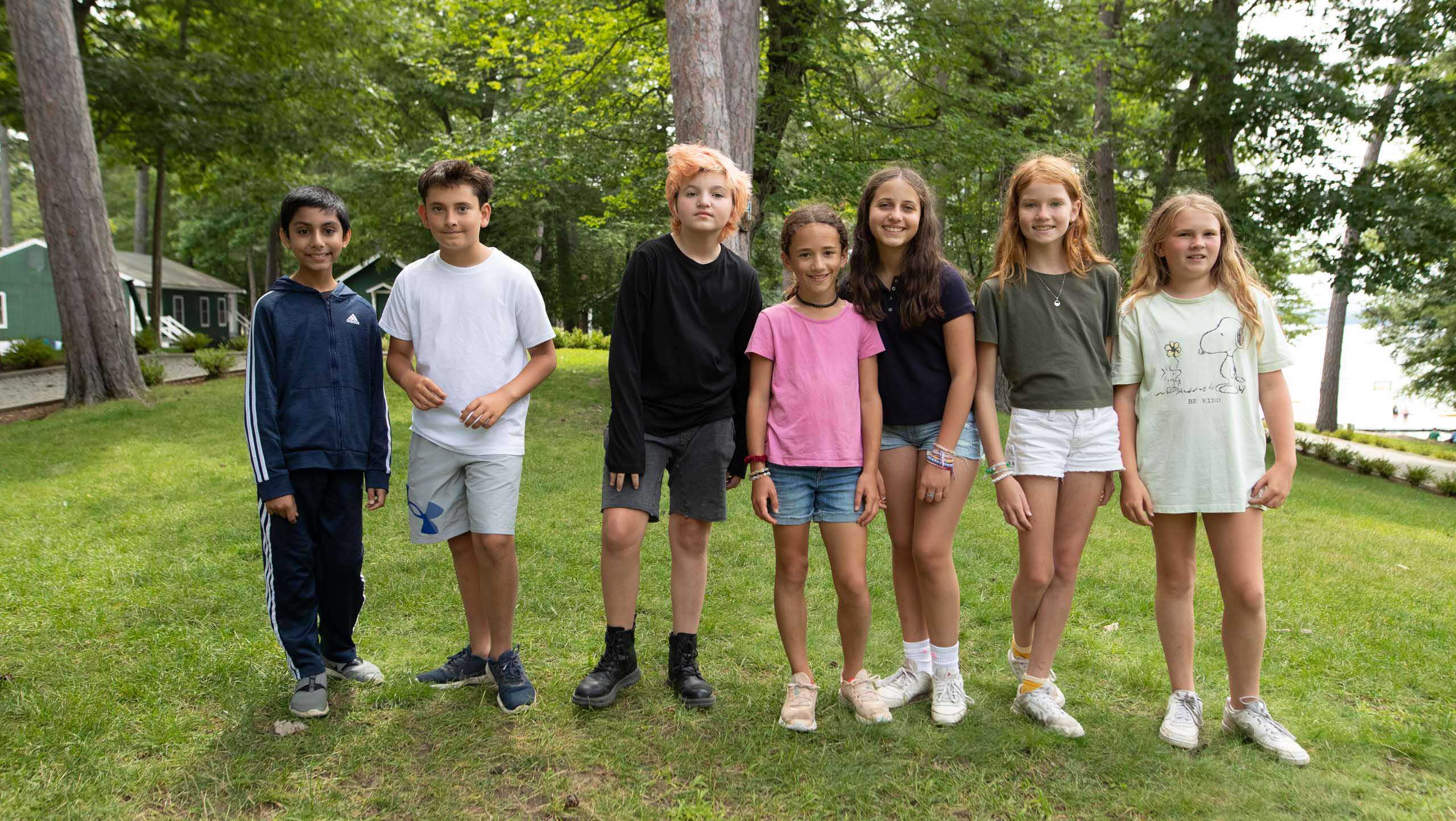 Kids standing smiling.